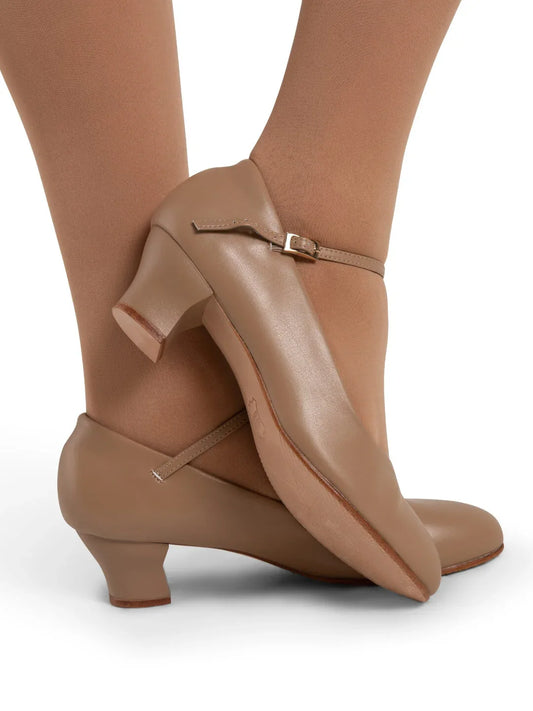 Mia Jr 1.5″ caramel character shoe featuring PU microfiber upper, sculpted heel, adjustable strap, and leather sole shown on model