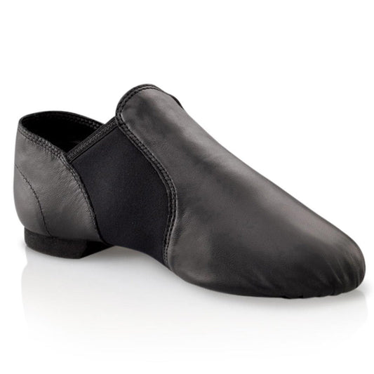 Capezio E‑Series Jazz slip‑on in black leather with elastic side panels, split‑sole design, padded collar and heel counter, perfect for dance and practice.