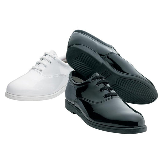 Dinkles Formal marching band shoe in black or white slick upper with lace-up oxford styling, padded collar, and low-profile heel—designed for parade and concert uniform polish. Sole view of Dinkles Formal marching shoe featuring non-marking rubber outsole with pivot disc and shallow flex grooves for secure grip on turf and stage.