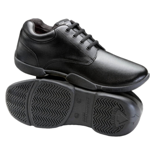 Super Drillmasters marching shoe in black full‑grain leather with lace‑up oxford styling, padded collar, cushioned tongue, and reinforced eyelets for durability during performances. Sole view of Super Drillmasters shoe featuring non‑marking rubber outsole with pivot disc, shallow flex grooves, and shallow tread pattern designed for grip on turf and gym surfaces.